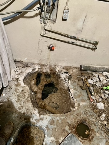 Underground drain piping exposed beneath a concrete slab during a plumbing repair in Austin, TX