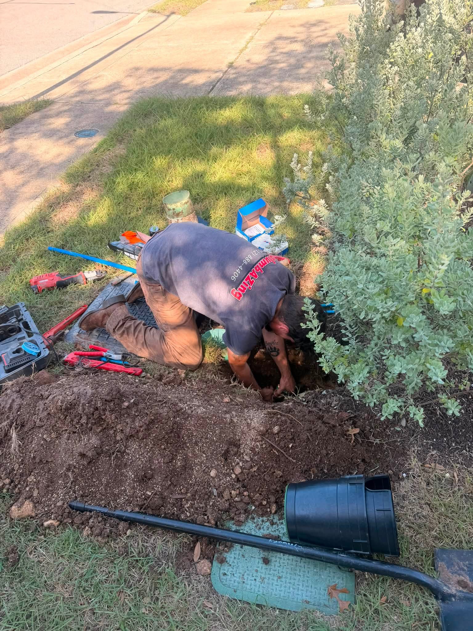 PlumbAZING plumber installing a new water heater in an Austin home