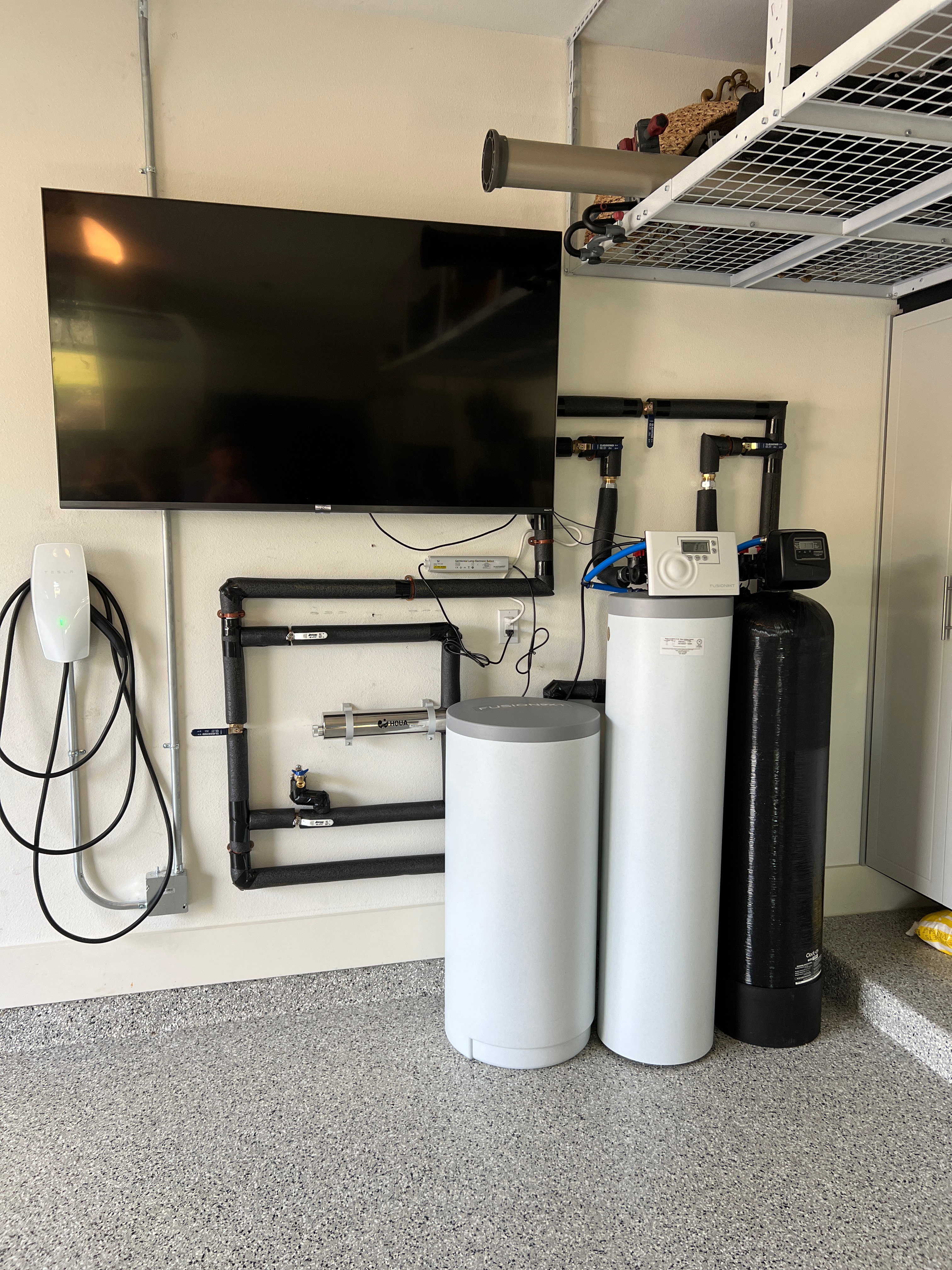 Water softener installed in the garage of an Austin home