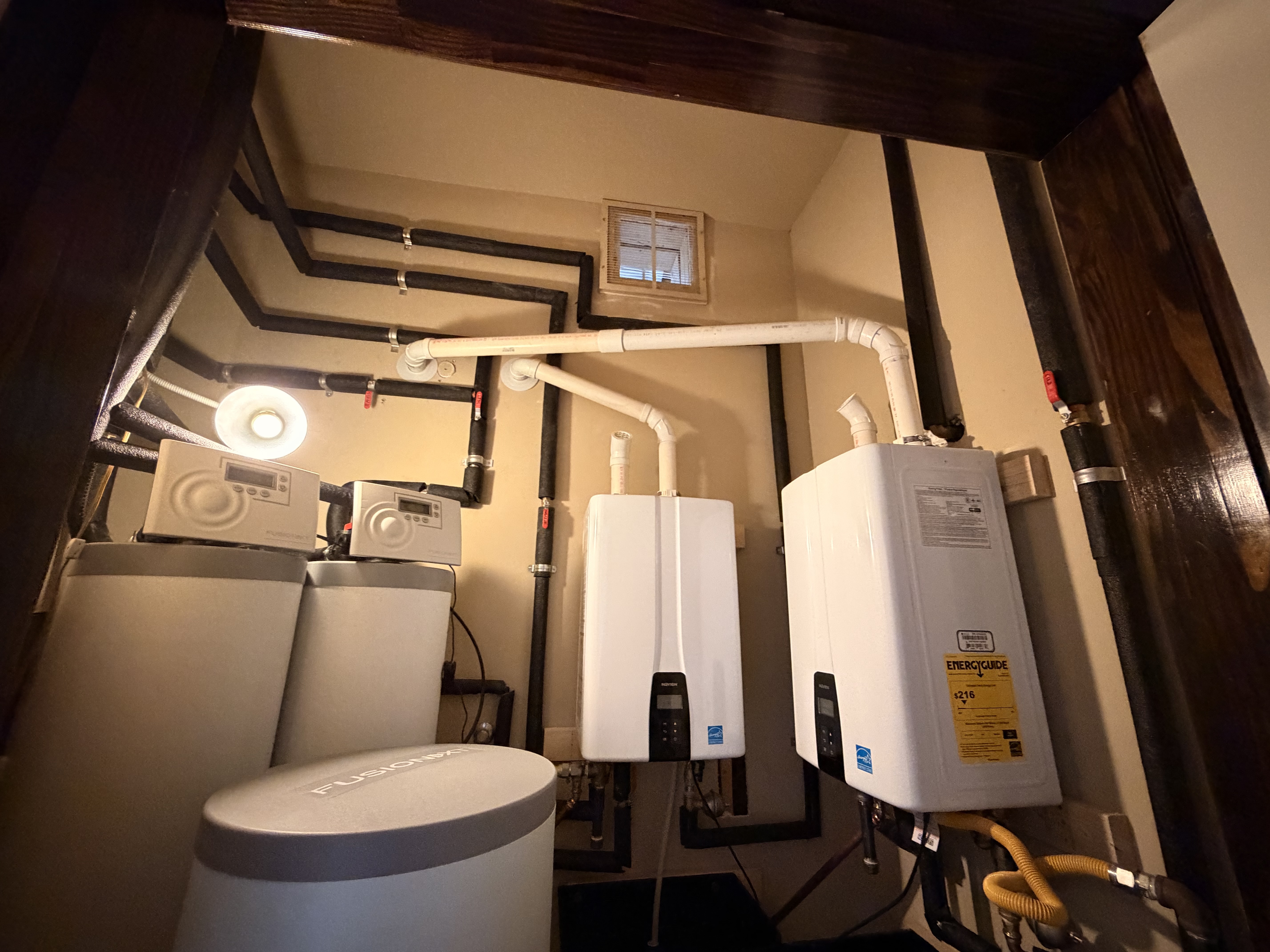Tankless water heater installed on the wall of an Austin home
